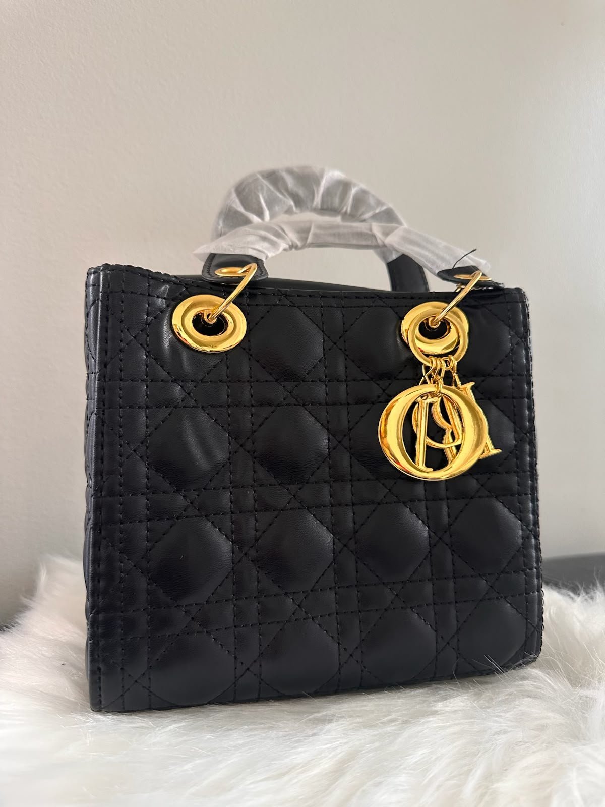 Sac à main Dior noir matelassé à doubles poignées